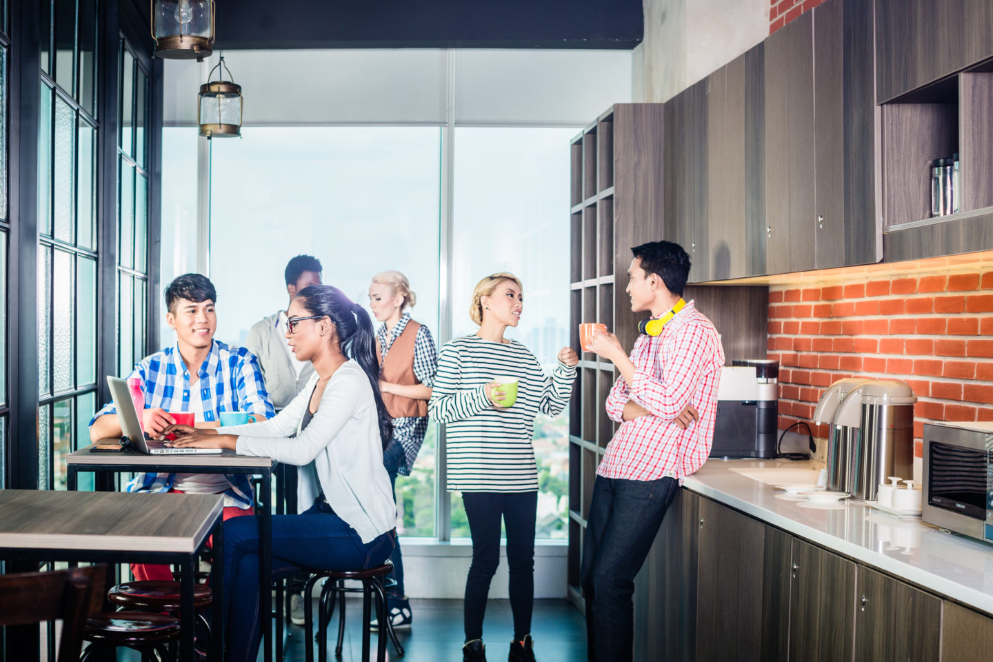 Team having coffee in lounge of start-up business